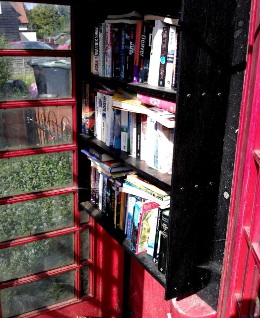 A former BT phone box containing books in rural Essex.